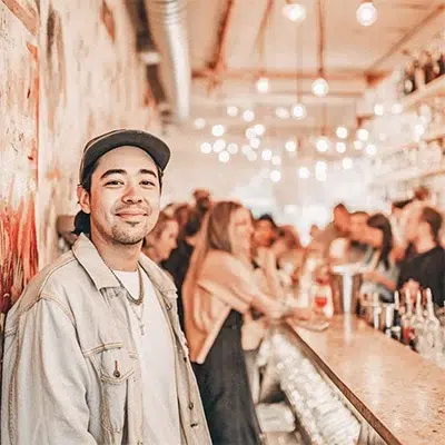 patron inside of a bar with a warm atmosphere